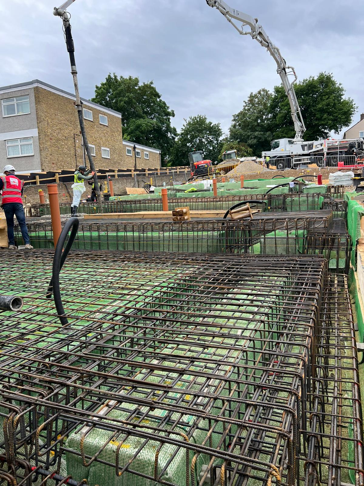 Rebar installation with concrete pump on residential site at Southall Waterside